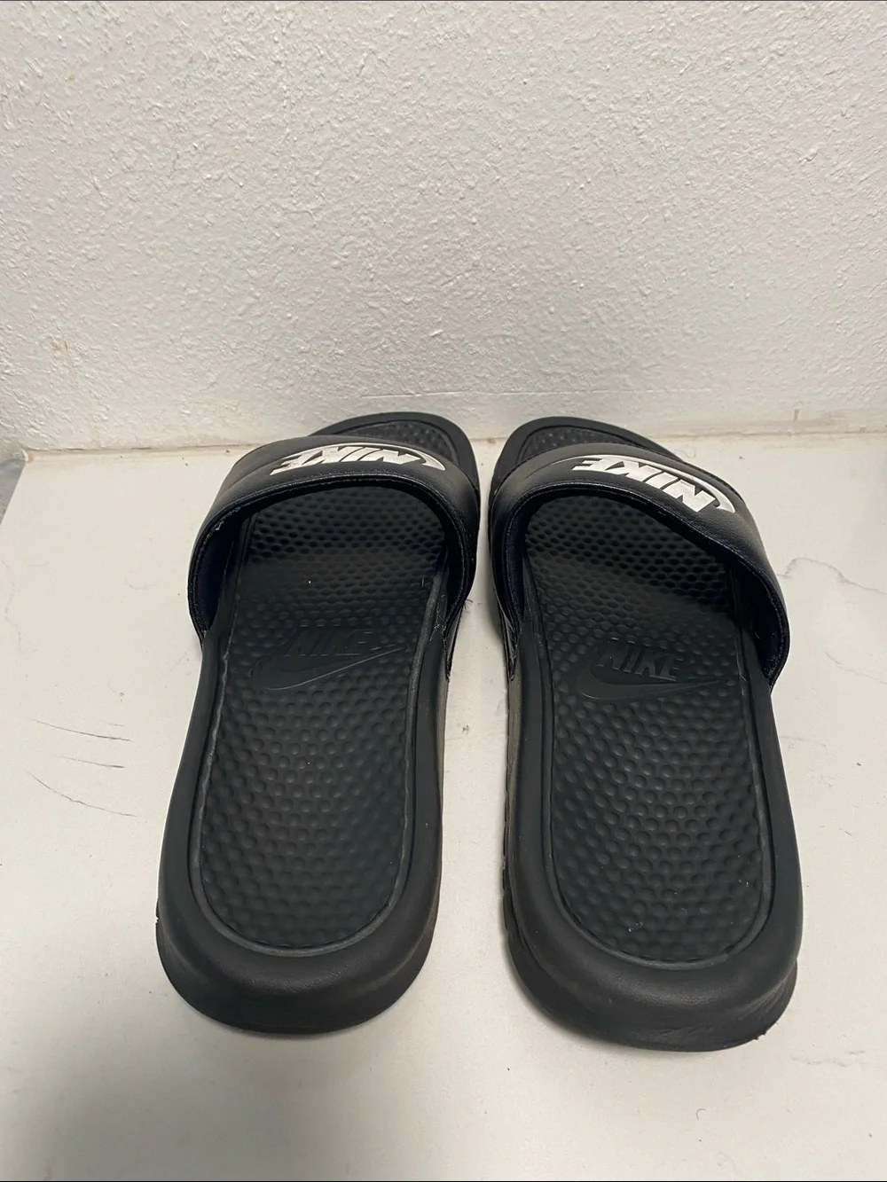Nike Black Slide Sandals with White Swoosh Logo - Kids